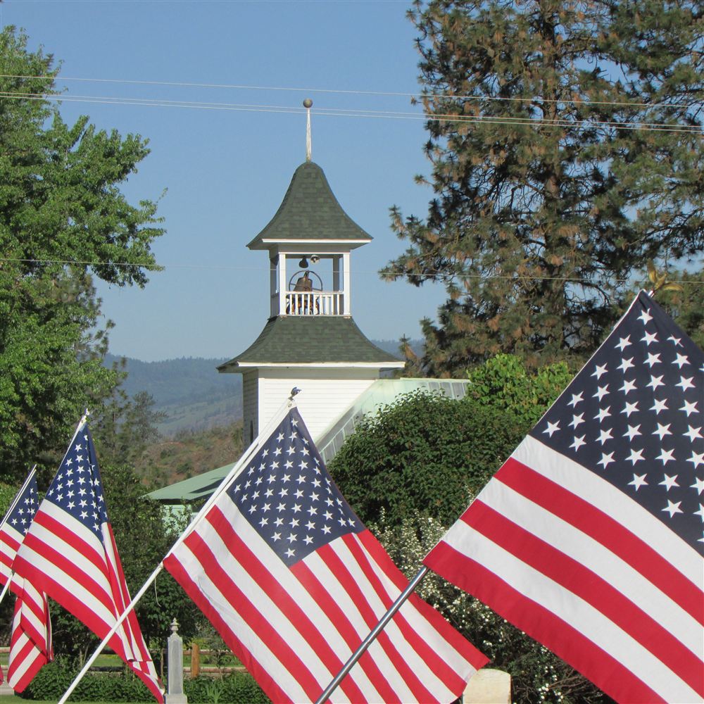 Cedonia Community Church bell tower with American flags on Memorial Day